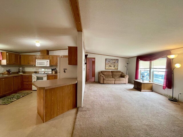 902 State Route 61 Lot # 92, Marengo, OH 43334 - kitchen featuring white appliances, a textured ceiling, light colored carpet, open floor plan, and brown cabinetry