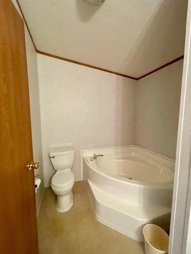 902 State Route 61 Lot # 92, Marengo, OH 43334 - bathroom featuring toilet, a bath, ornamental molding, and a textured ceiling