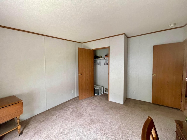 902 State Route 61 Lot # 92, Marengo, OH 43334 - unfurnished bedroom with crown molding, carpet floors, a textured ceiling, and a closet