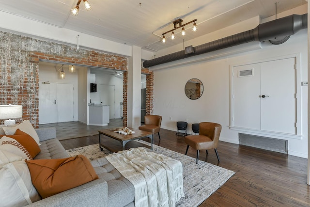 432 E Rich St Unit 4A, Columbus, OH 43215 - living area with wood finished floors and brick wall