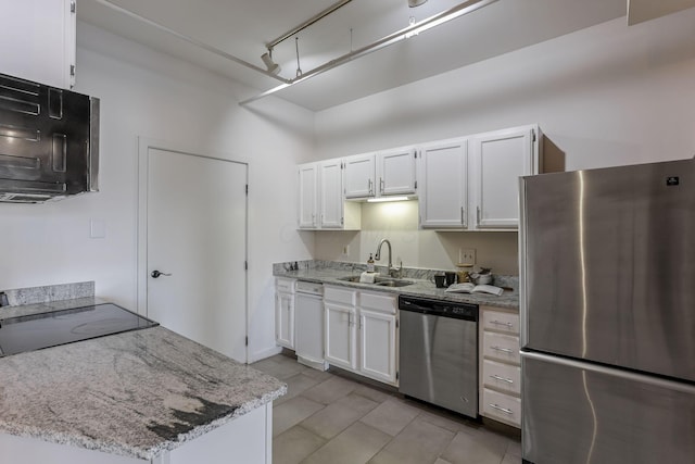 432 E Rich St Unit 4A, Columbus, OH 43215 - kitchen featuring appliances with stainless steel finishes, white cabinets, and light stone countertops