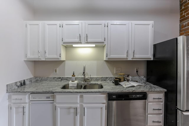 432 E Rich St Unit 4A, Columbus, OH 43215 - kitchen with appliances with stainless steel finishes, white cabinets, and light stone counters