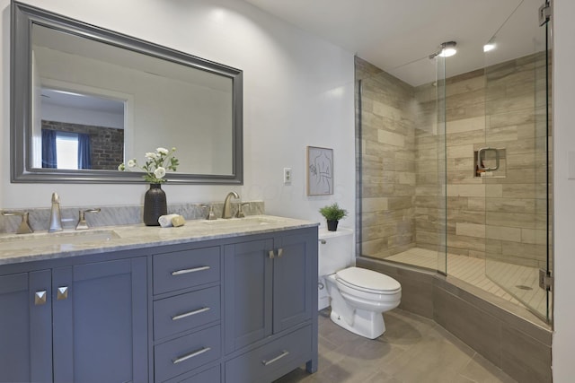 432 E Rich St Unit 4A, Columbus, OH 43215 - bathroom with a shower stall, double vanity, and tile patterned flooring