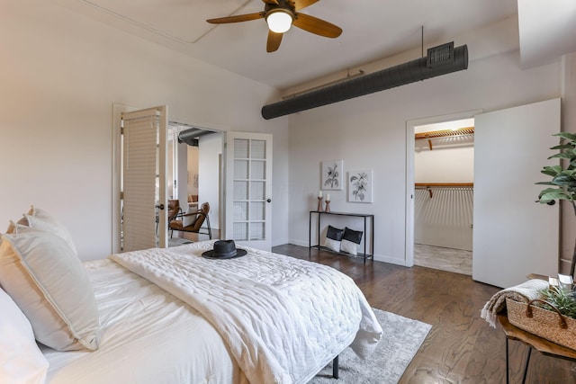 432 E Rich St Unit 4A, Columbus, OH 43215 - bedroom featuring wood finished floors, a walk in closet, ceiling fan, and a closet