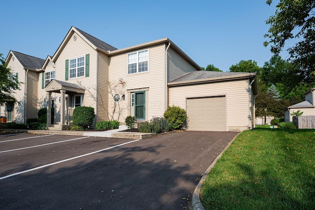 1845 Messner Dr Unit 57E, Hilliard, OH 43026 - view of front facade featuring a front lawn and uncovered parking