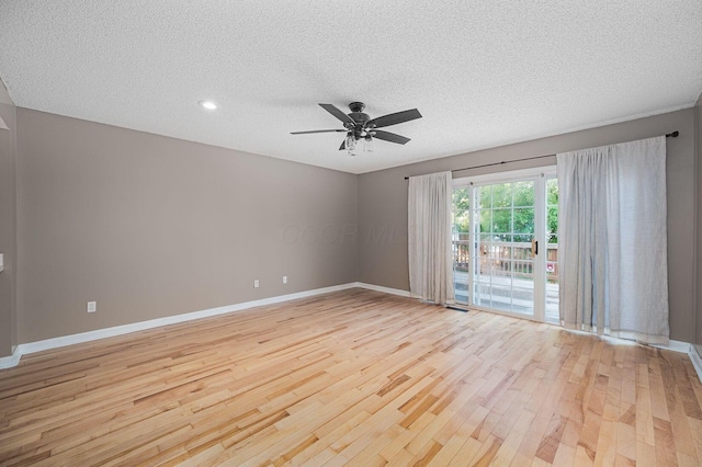 1845 Messner Dr Unit 57E, Hilliard, OH 43026 - spare room featuring light wood-style flooring, a textured ceiling, baseboards, a ceiling fan, and recessed lighting