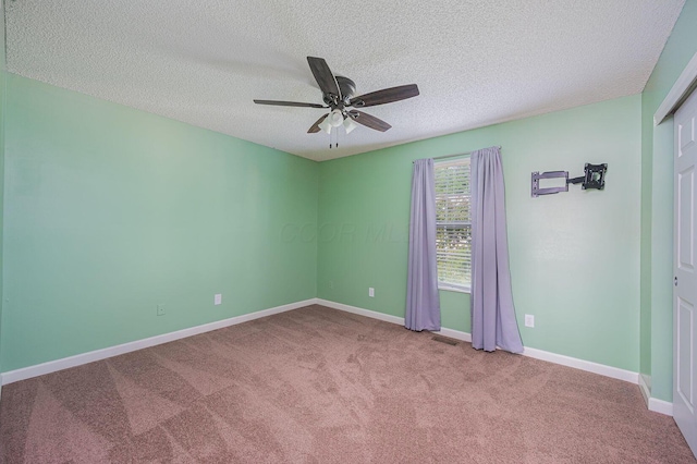 1845 Messner Dr Unit 57E, Hilliard, OH 43026 - carpeted spare room featuring a textured ceiling, ceiling fan, and baseboards
