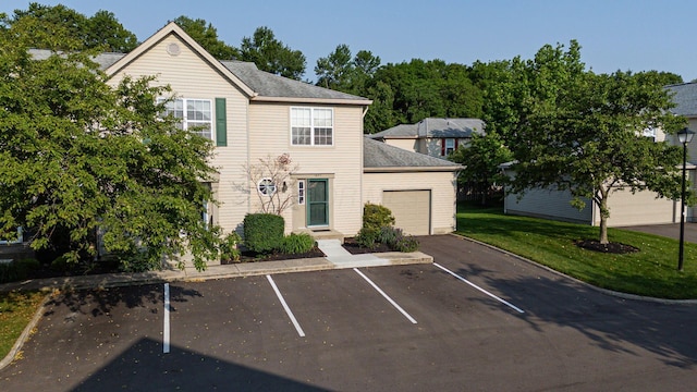 1845 Messner Dr Unit 57E, Hilliard, OH 43026 - view of front of house with uncovered parking and a front yard