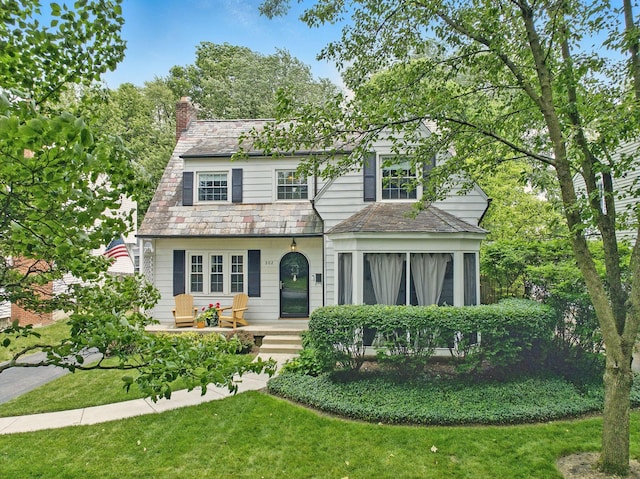 202 N Stanwood Rd, Bexley, OH 43209 - view of front of home with a high end roof, a chimney, and a front lawn