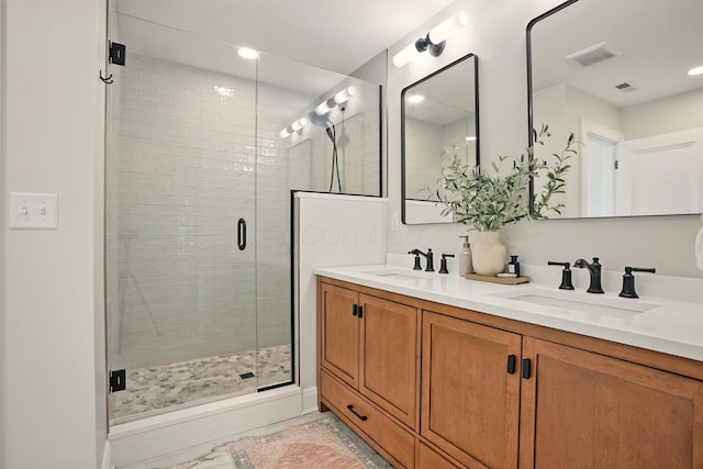 202 N Stanwood Rd, Bexley, OH 43209 - full bathroom featuring double vanity, a shower stall, marble finish flooring, and recessed lighting