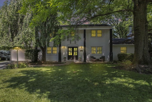 4286 Evansdale Rd, Columbus, OH 43214 - back of house with a lawn and concrete driveway
