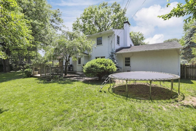 4286 Evansdale Rd, Columbus, OH 43214 - view of yard featuring a trampoline and a deck