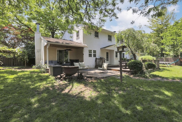 4286 Evansdale Rd, Columbus, OH 43214 - back of house featuring ceiling fan, a patio area, an outdoor hangout area, a chimney, and stucco siding