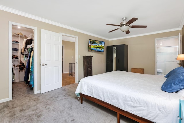 4286 Evansdale Rd, Columbus, OH 43214 - bedroom featuring a spacious closet, ornamental molding, a closet, carpet floors, and connected bathroom