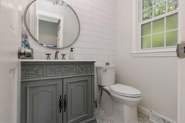 4286 Evansdale Rd, Columbus, OH 43214 - half bathroom with vanity, tile walls, and tile patterned floors