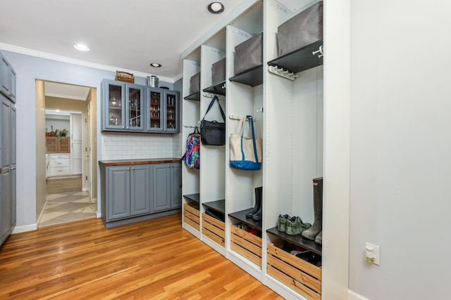 4286 Evansdale Rd, Columbus, OH 43214 - mudroom with crown molding, light wood finished floors, and recessed lighting