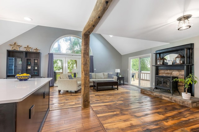 170 Nantucket Ave, Pickerington, OH 43147 - living room featuring vaulted ceiling, hardwood / wood-style floors, and a wood stove