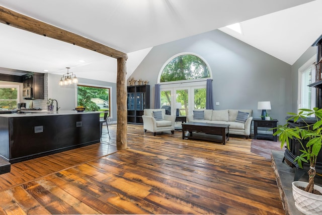 170 Nantucket Ave, Pickerington, OH 43147 - living room with healthy amount of natural light, hardwood / wood-style floors, a chandelier, and high vaulted ceiling