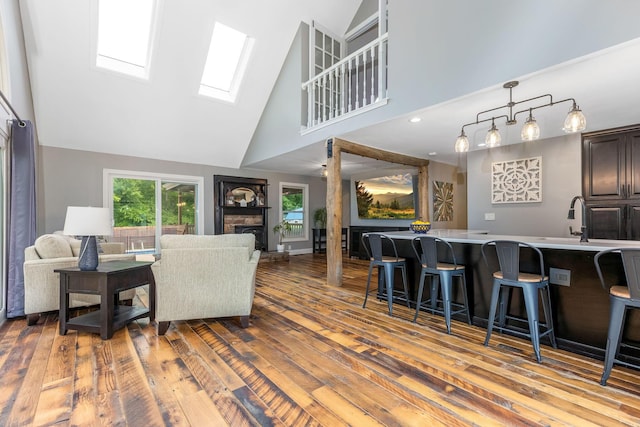 170 Nantucket Ave, Pickerington, OH 43147 - living area featuring high vaulted ceiling, a skylight, hardwood / wood-style flooring, and a fireplace