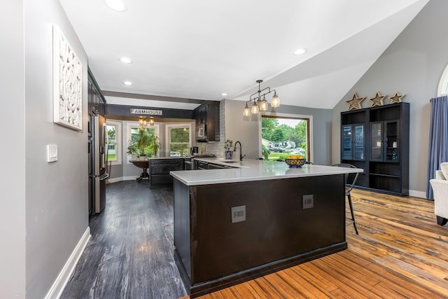 170 Nantucket Ave, Pickerington, OH 43147 - kitchen with light countertops, appliances with stainless steel finishes, a peninsula, dark wood-style flooring, and recessed lighting