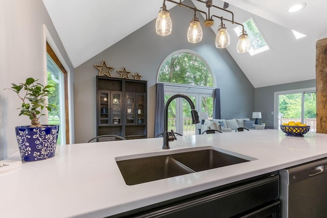 170 Nantucket Ave, Pickerington, OH 43147 - kitchen featuring dishwasher, a skylight, light countertops, high vaulted ceiling, and open floor plan