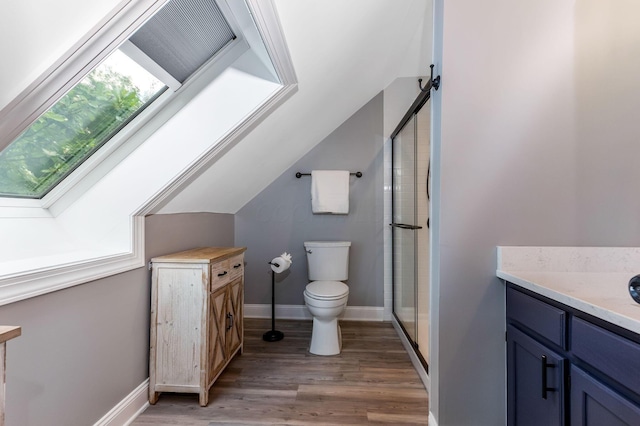 170 Nantucket Ave, Pickerington, OH 43147 - full bathroom featuring vanity, a shower stall, wood finished floors, vaulted ceiling, and a skylight