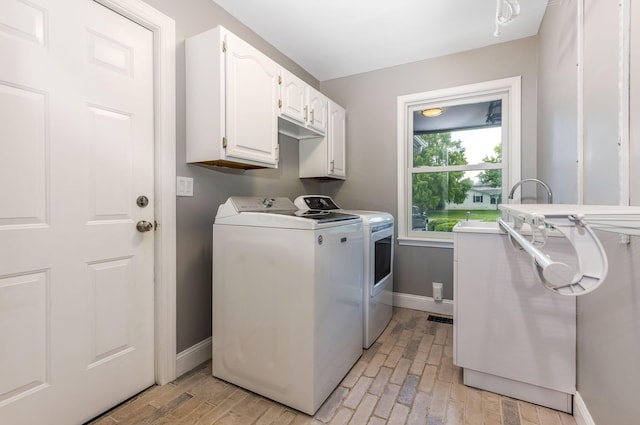 170 Nantucket Ave, Pickerington, OH 43147 - laundry room featuring cabinet space, separate washer and dryer, and light wood-type flooring