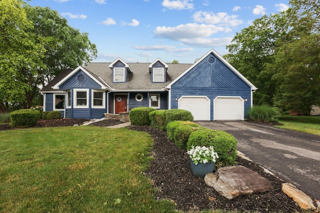 170 Nantucket Ave, Pickerington, OH 43147 - cape cod home featuring a garage, asphalt driveway, and a front lawn