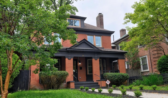 39 Auburn Ave, Columbus, OH 43205 - traditional style home featuring brick siding, covered porch, and a chimney