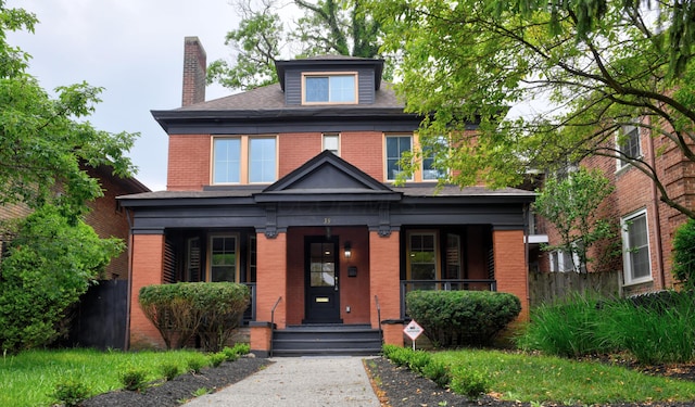 39 Auburn Ave, Columbus, OH 43205 - american foursquare style home with brick siding, a porch, and a chimney