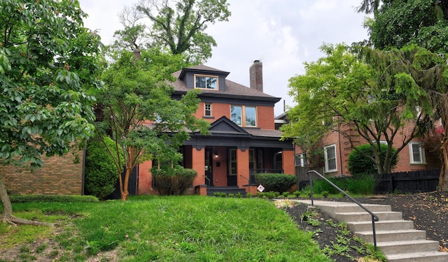 39 Auburn Ave, Columbus, OH 43205 - american foursquare style home featuring brick siding, a chimney, and a porch