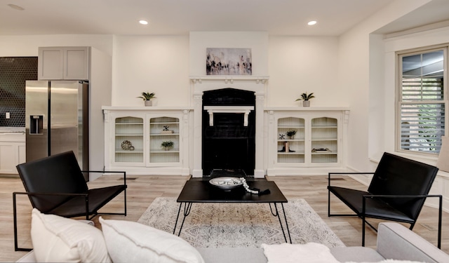 39 Auburn Ave, Columbus, OH 43205 - living area with light wood-style flooring, a fireplace, and recessed lighting