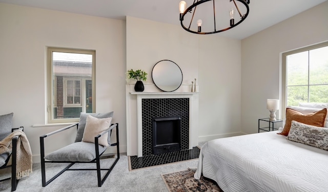 39 Auburn Ave, Columbus, OH 43205 - bedroom featuring a chandelier, multiple windows, a fireplace, and carpet