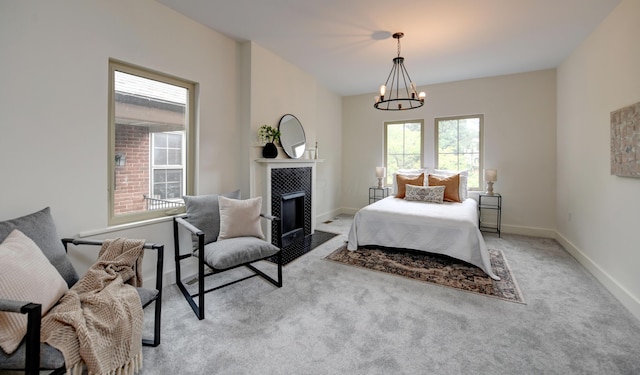 39 Auburn Ave, Columbus, OH 43205 - carpeted bedroom with a chandelier, a fireplace with flush hearth, and baseboards