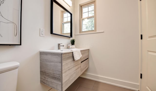 39 Auburn Ave, Columbus, OH 43205 - bathroom with toilet, vanity, tile patterned floors, and baseboards