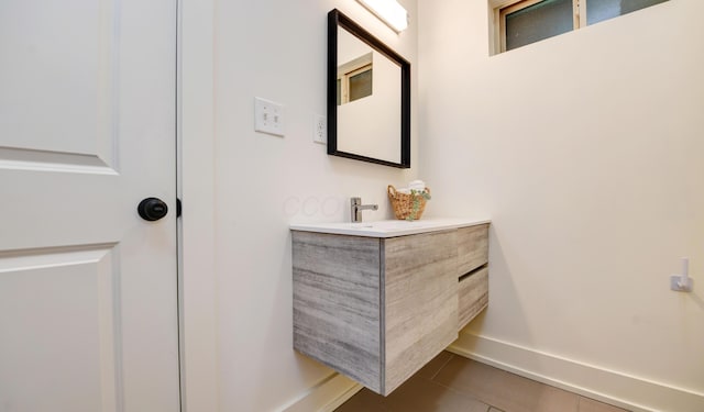 39 Auburn Ave, Columbus, OH 43205 - bathroom with baseboards, vanity, and tile patterned flooring