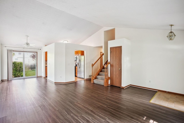 2147 Juneau Way, Grove City, OH 43123 - unfurnished living room with stairway, vaulted ceiling, a ceiling fan, and dark wood finished floors