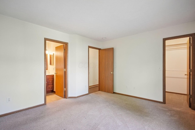 2147 Juneau Way, Grove City, OH 43123 - unfurnished bedroom with a spacious closet, light carpet, connected bathroom, and a closet
