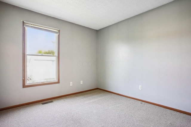 2147 Juneau Way, Grove City, OH 43123 - spare room featuring carpet floors and a textured ceiling