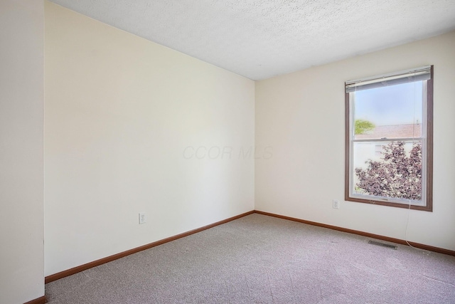 2147 Juneau Way, Grove City, OH 43123 - spare room featuring carpet floors and a textured ceiling