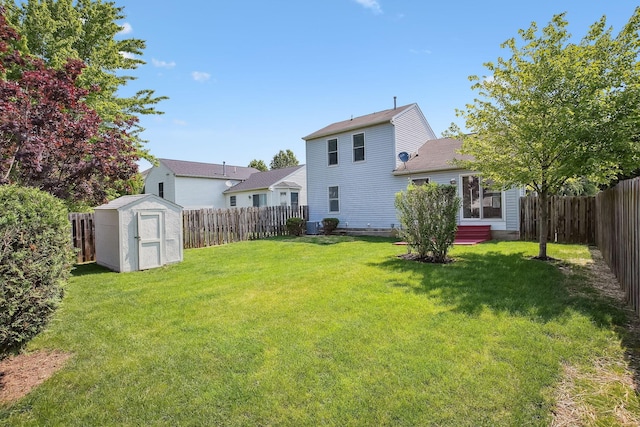 2147 Juneau Way, Grove City, OH 43123 - back of property with a storage unit, a fenced backyard, and roof with shingles