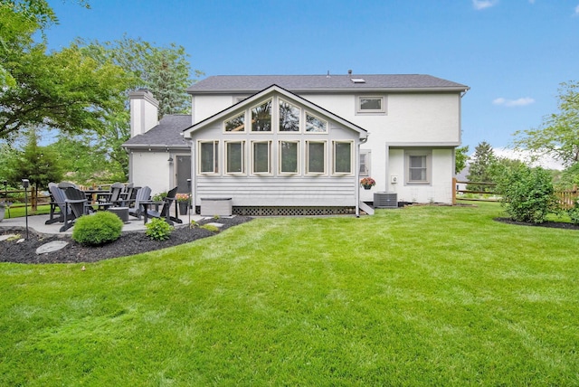 3040 Atoll Dr, Lewis Center, OH 43035 - back of house with a patio, a chimney, and roof with shingles
