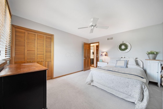 3040 Atoll Dr, Lewis Center, OH 43035 - bedroom with light colored carpet, a closet, and a ceiling fan
