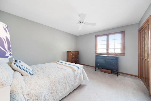 3040 Atoll Dr, Lewis Center, OH 43035 - bedroom featuring a closet, light colored carpet, and ceiling fan