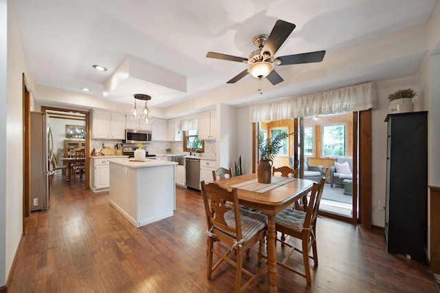 3040 Atoll Dr, Lewis Center, OH 43035 - dining space with dark wood-type flooring, a ceiling fan, healthy amount of natural light, and recessed lighting