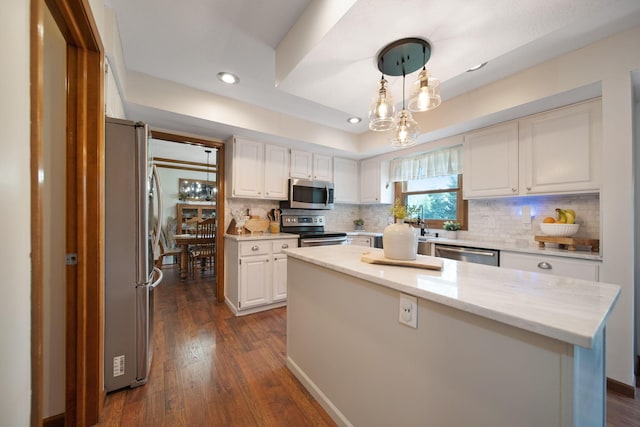 3040 Atoll Dr, Lewis Center, OH 43035 - kitchen with stainless steel appliances, a center island, backsplash, white cabinets, and recessed lighting