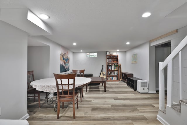 3216 Howey Rd, Columbus, OH 43224 - dining room with stairway, light wood-style flooring, recessed lighting, and baseboards