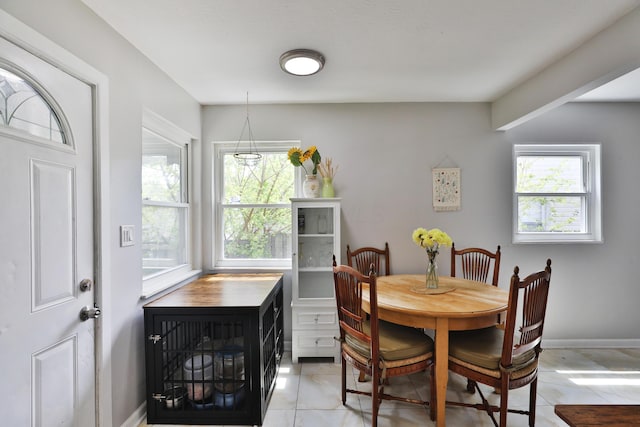 3216 Howey Rd, Columbus, OH 43224 - dining area featuring light tile patterned floors and baseboards