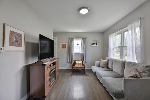 3216 Howey Rd, Columbus, OH 43224 - living room featuring baseboards and dark wood-style floors