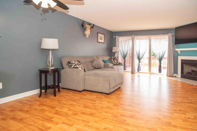 2043 Coleman Dr Unit 6F, Columbus, OH 43235 - living area featuring ceiling fan, wood finished floors, a fireplace, and baseboards